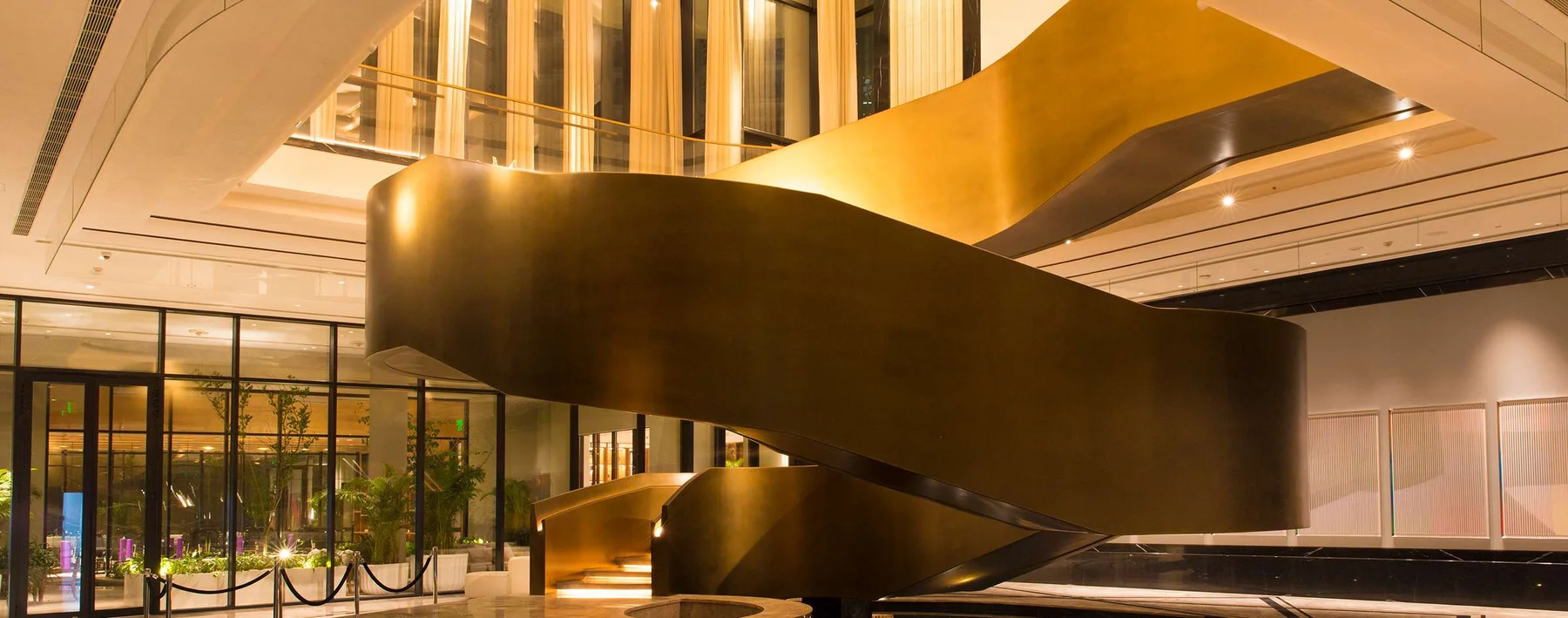 Sculptural bronze staircase in The Camellias Club